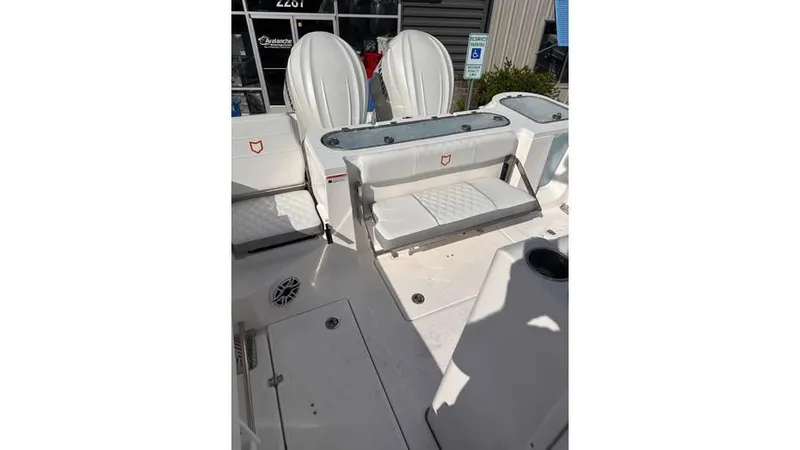 Slide: The Image of 2025 Sea Fox 328 Commander boat interior with seating and storage. - 25