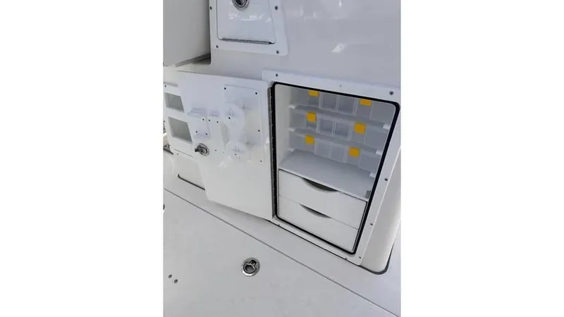 Slide: The Image of 2025 Sea Fox 328 Commander storage compartments and tackle boxes. - 26