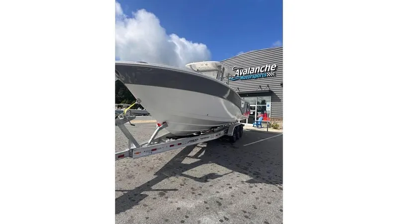 Slide: The Image of 2025 Sea Fox 328 Commander boat on trailer outside Avalanche dealership. - 30