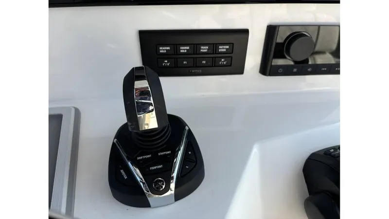 Slide: The Image of Control panel of 2025 Sea Fox 328 Commander boat with joystick and buttons. - 31