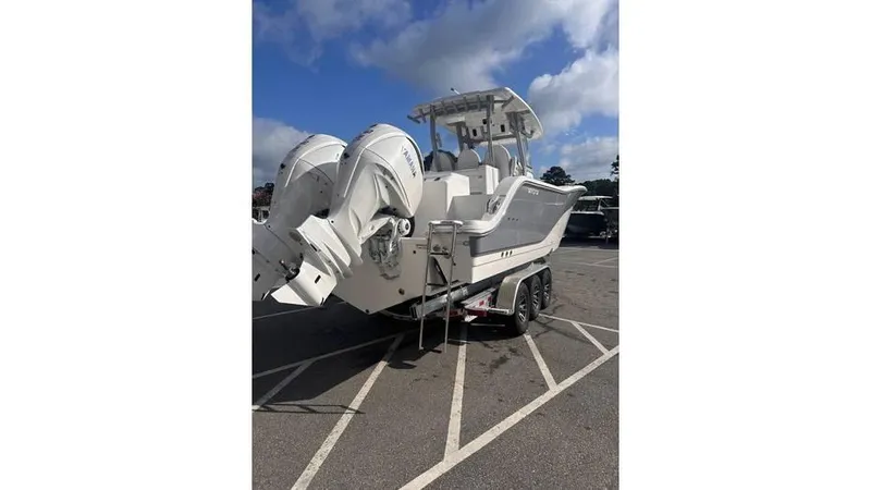Slide: The Image of 2025 Sea Fox 328 Commander boat with twin outboard engines on a trailer. - 5