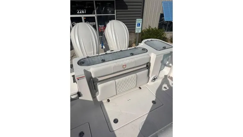 Slide: The Image of 2025 Sea Fox 328 Commander boat interior with seating and storage. - 9