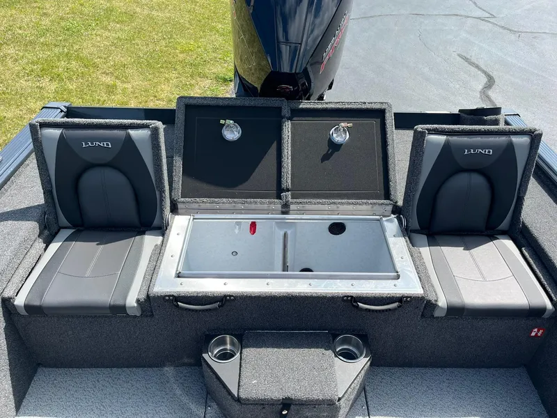 Slide: The Image of 2025 Lund 2075 Pro-V Bass XS boat interior with seating and storage compartments. - 13