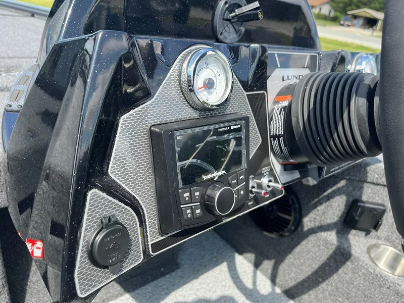 Slide: The Image of Dashboard of 2025 Lund 2075 Pro-V Bass XS boat with modern controls and gauges. - 17
