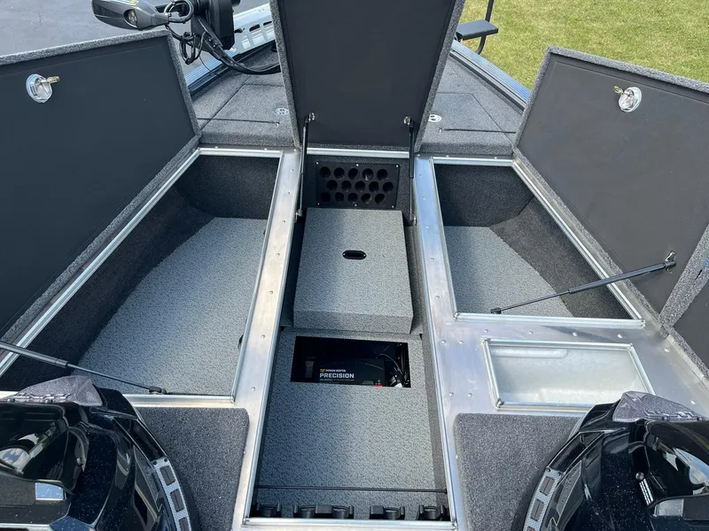 Slide: The Image of 2025 Lund 2075 Pro-V Bass XS boat storage compartments open, showcasing spacious interior design. - 21