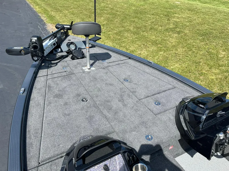 Slide: The Image of 2025 Lund 2075 Pro-V Bass XS boat deck with fishing seat and trolling motor. - 22