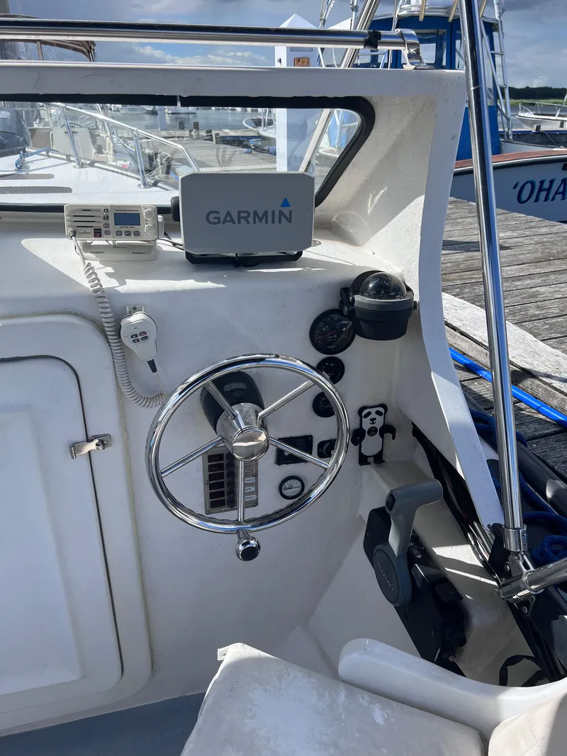 Slide: The Image of 1996 Seabreeze 19 Cuddy boat helm with Garmin GPS and marine radio. - 10
