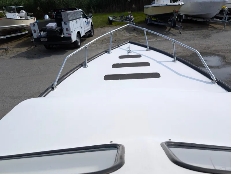 Slide: The Image of 1996 Seabreeze 19 Cuddy boat bow view at a marina. - 4