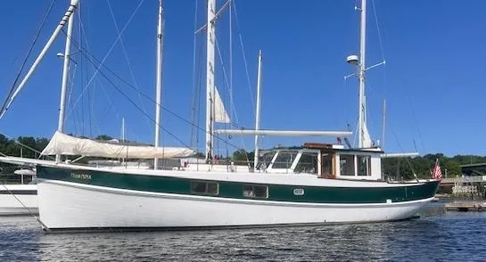 The Image of Custom 1996 Bolger PH Shoal-draft Ketch sailing on calm waters under clear blue sky. - 0