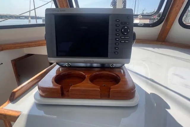 Slide: The Image of Cockpit of 1996 Custom Bolger PH Shoal-draft Ketch with navigation system and cup holders. - 15