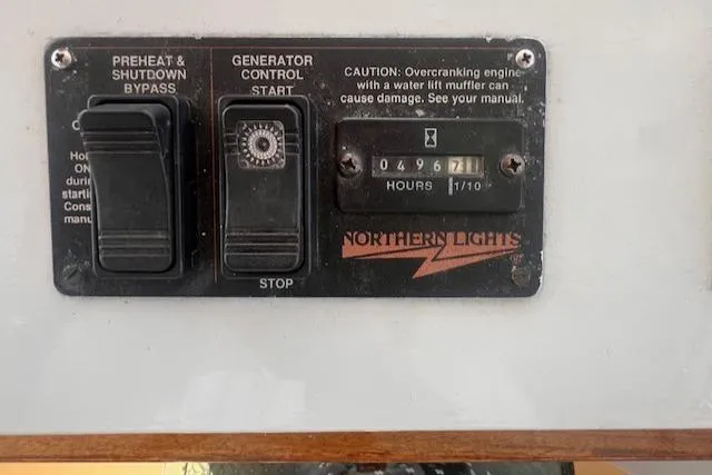 Slide: The Image of Control panel of a 1996 Custom Bolger PH Shoal-draft Ketch with generator hour meter. - 16