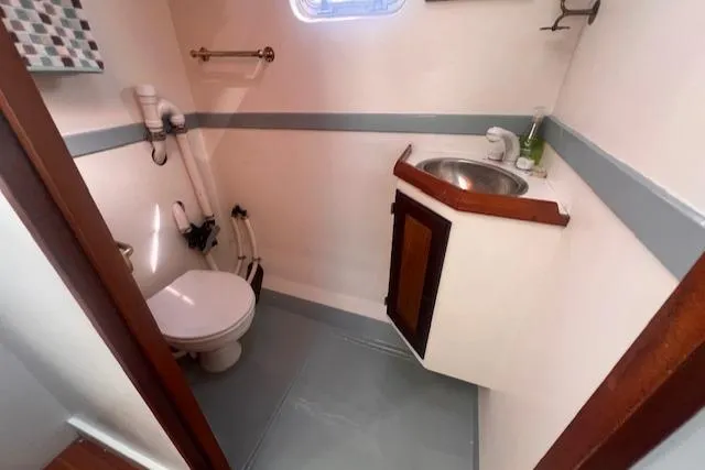 Slide: The Image of Bathroom interior of 1996 Custom Bolger PH Shoal-draft Ketch with sink and toilet. - 28