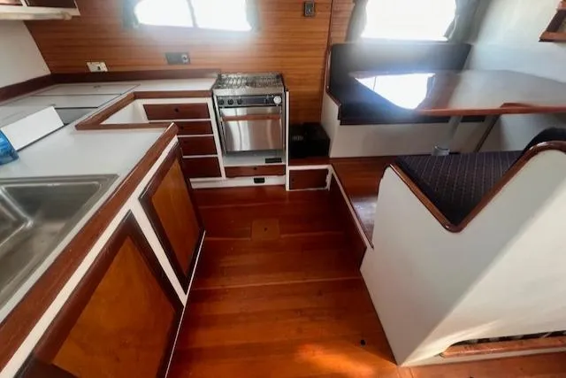 Slide: The Image of Interior of 1996 Custom Bolger PH Shoal-draft Ketch with kitchen and dining area. - 34
