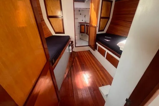 Slide: The Image of Interior of 1996 Custom Bolger PH Shoal-draft Ketch with wooden finishes and cozy sleeping area. - 35