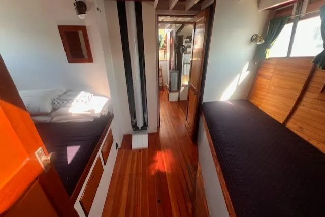 Slide: The Image of Interior of 1996 Custom Bolger PH Shoal-draft Ketch with wooden flooring and cozy berths. - 39