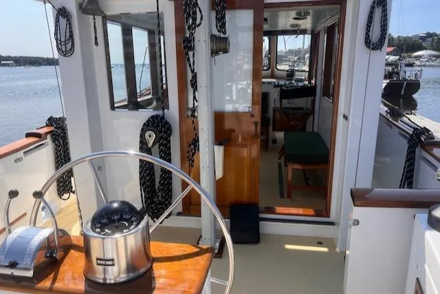Slide: The Image of Interior view of a 1996 Custom Bolger PH Shoal-draft Ketch sailboat with steering wheel. - 41