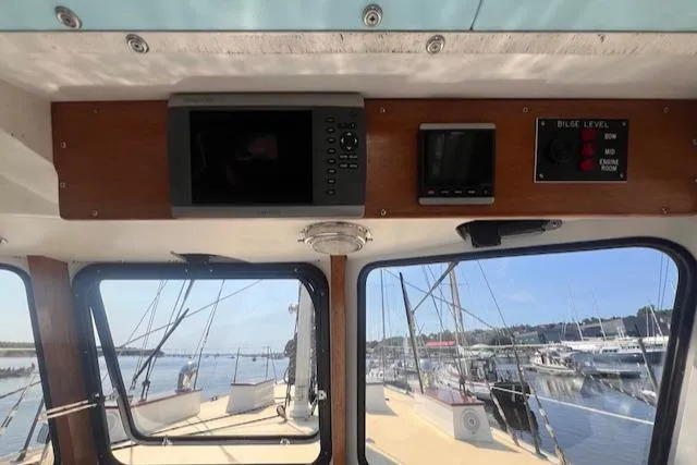 Slide: The Image of Interior view of 1996 Custom Bolger PH Shoal-draft Ketch, showing navigation equipment and marina. - 42