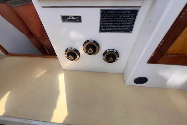 Slide: The Image of Control panel of a 1996 Custom Bolger PH Shoal-draft Ketch with labeled dials and instructions. - 46