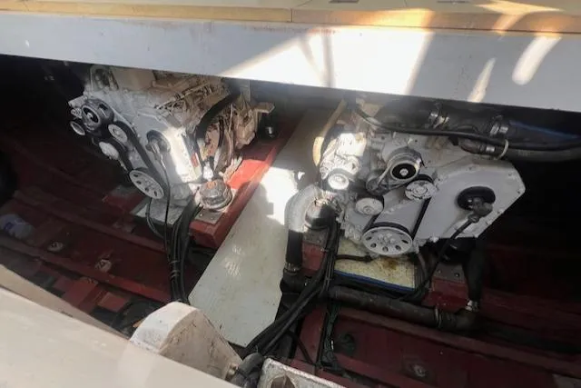 Slide: The Image of Engine room of 1996 Custom Bolger PH Shoal-draft Ketch, showcasing dual engines and mechanical components. - 47