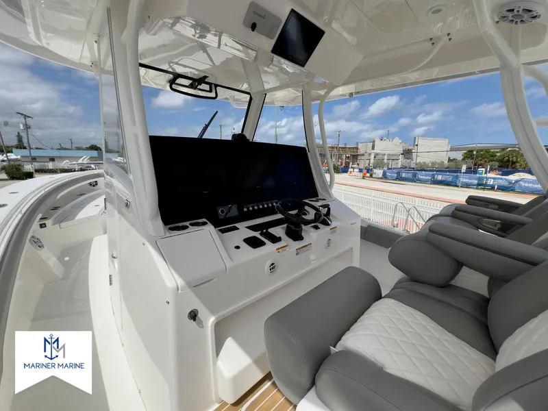 Slide: The Image of 2024 Regulator 37 boat cockpit with modern controls and comfortable seating. - 17