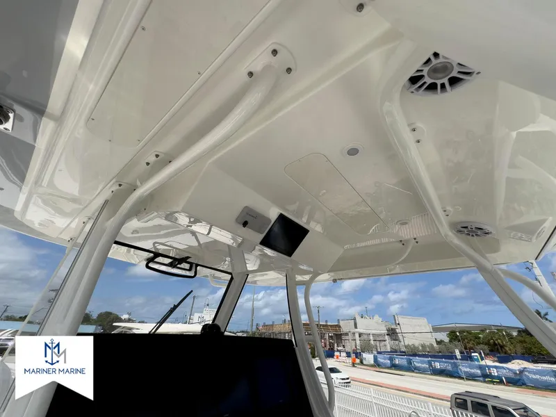 Slide: The Image of 2024 Regulator 37 boat interior with modern design and advanced features, Mariner Marine branding visible. - 18