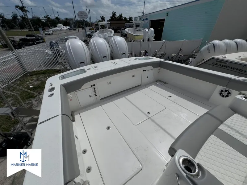 Slide: The Image of 2024 Regulator 37 boat deck with multiple outboard engines at Mariner Marine. - 19