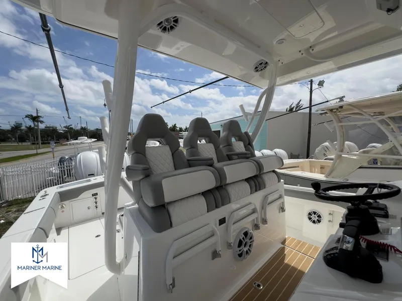 Slide: The Image of 2024 Regulator 37 boat interior with luxury seating and modern helm design. - 25