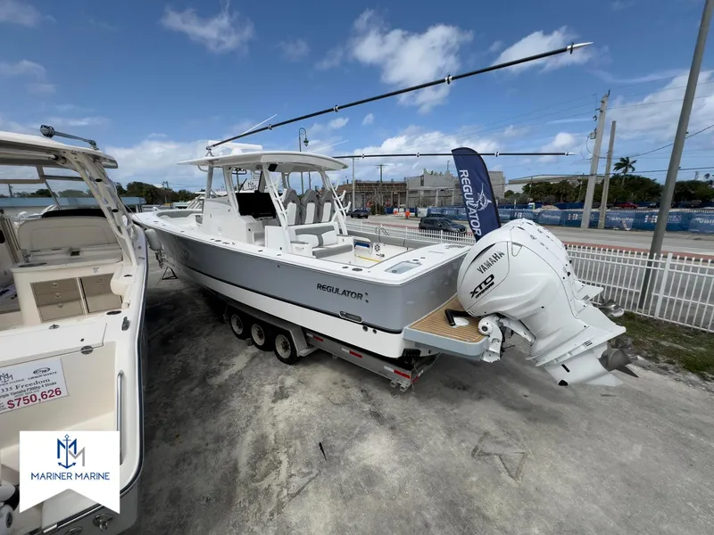 Slide: The Image of 2024 Regulator 37 boat with Yamaha engines displayed at Mariner Marine dealership. - 3