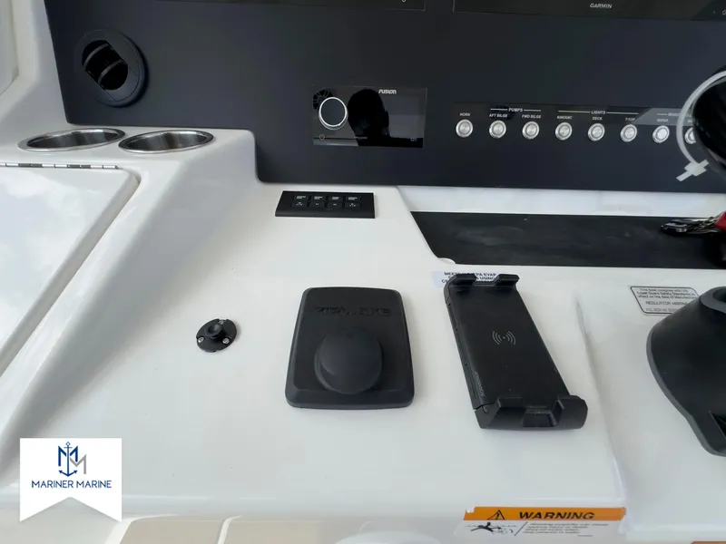 Slide: The Image of Control panel of 2024 Regulator 37 boat with various switches and controls. - 31