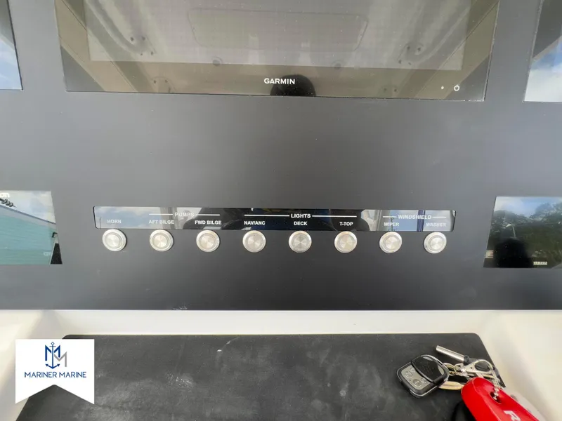 Slide: The Image of Control panel of 2024 Regulator 37 boat with Garmin display and keys. - 32