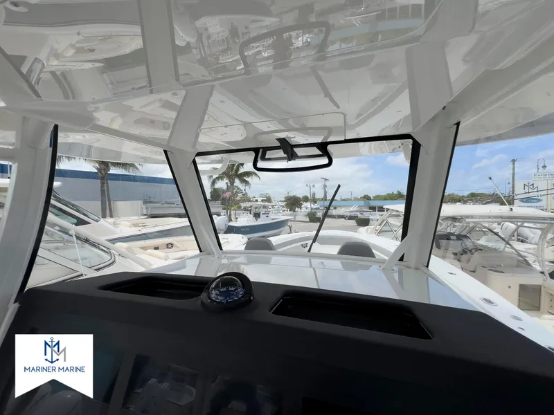 Slide: The Image of 2024 Regulator 37 boat interior with dashboard view at Mariner Marine. - 34