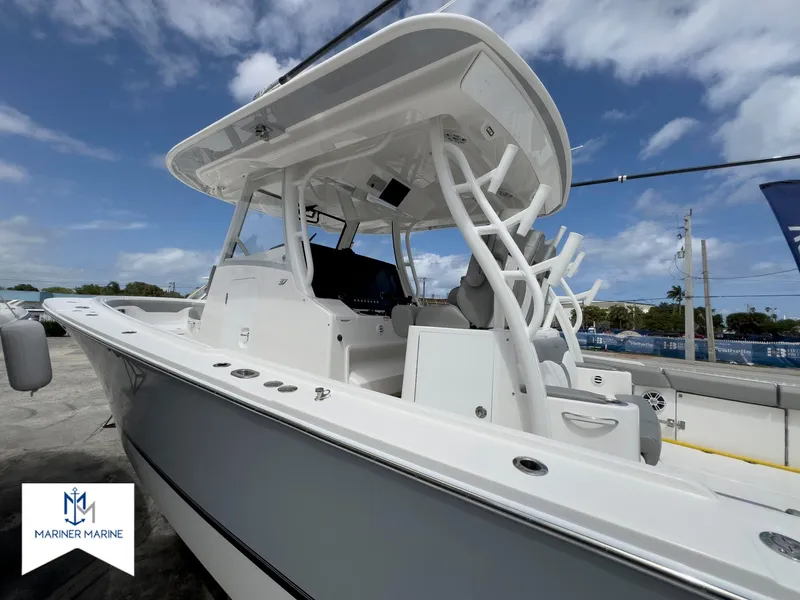 Slide: The Image of 2024 Regulator 37 boat with sleek design, white exterior, and modern features at Mariner Marine. - 4