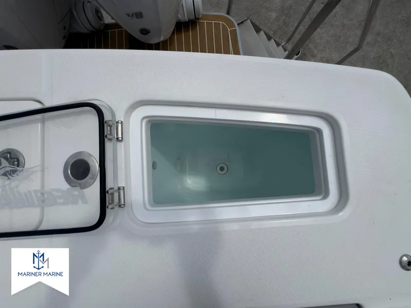 Slide: The Image of 2024 Regulator 37 boat livewell with open lid, Mariner Marine logo visible. - 43