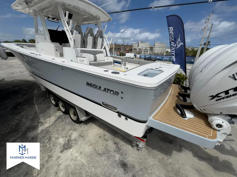 Slide: The Image of 2024 Regulator 37 boat with triple engines, displayed at Mariner Marine. - 48