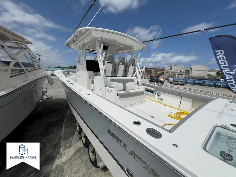 Slide: The Image of 2024 Regulator 37 boat at Mariner Marine, showcasing sleek design and spacious seating. - 49