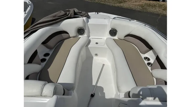 Slide: The Image of 2015 Hurricane SunDeck 2200 DC OB boat interior with cushioned seating. - 6