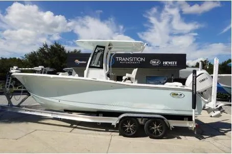 The Image of 2025 Sea Hunt Ultra 239 SE boat on trailer at dealership. - 0