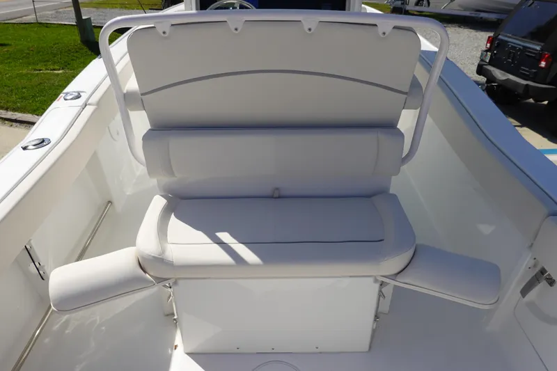 Slide: The Image of 2025 Sea Hunt Ultra 239 SE boat top view with rod holders and speakers under clear sky. - 12