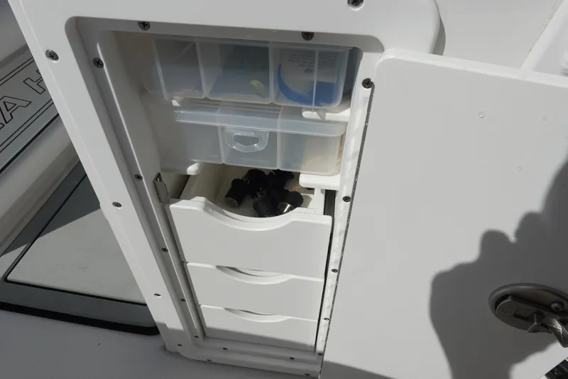 Slide: The Image of 2025 Sea Hunt Ultra 239 SE boat deck with logo, featuring sleek design elements. - 17