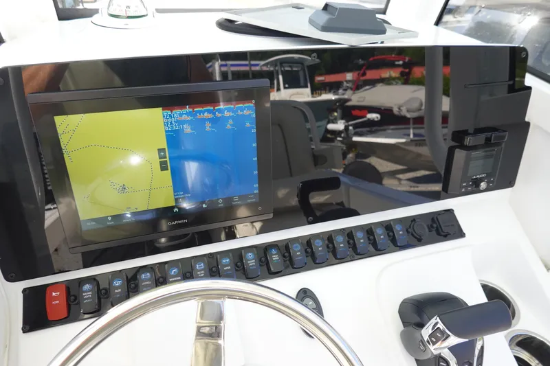 Slide: The Image of 2025 Sea Hunt Ultra 239 SE boat seat with white cushioned design. - 20