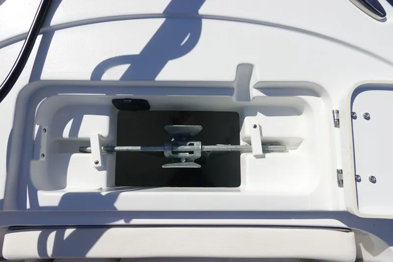 Slide: The Image of 2025 Sea Hunt Ultra 239 SE boat interior with storage compartments and seating. - 29