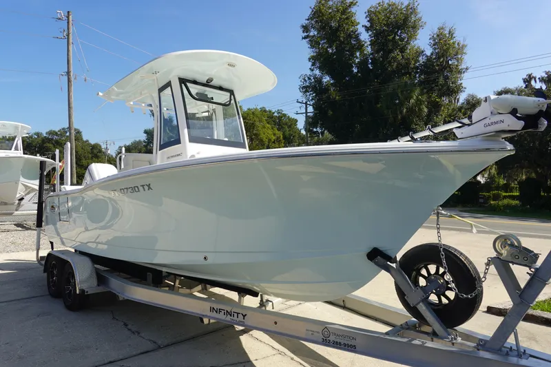 Slide: The Image of 2025 Sea Hunt Ultra 239 SE boat transom with Bennett trim tab and safety features. - 5