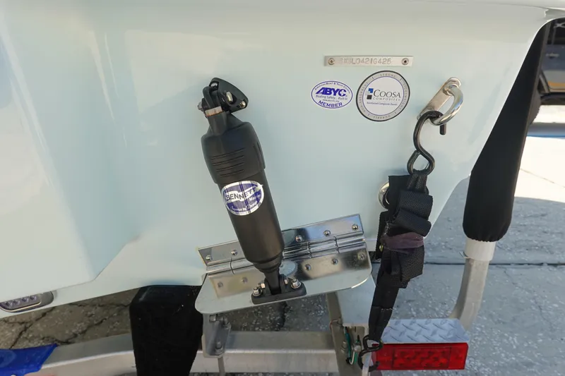 Slide: The Image of 2025 Sea Hunt Ultra 239 SE boat interior with white seating and storage compartments. - 7