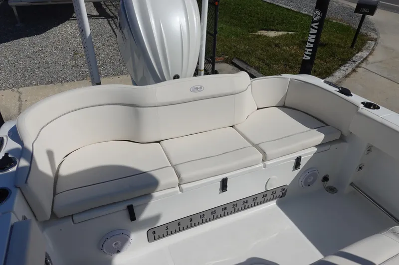 Slide: The Image of 2025 Sea Hunt Ultra 239 SE boat storage compartments and seating area. - 8
