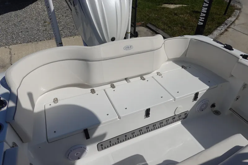 Slide: The Image of 2025 Sea Hunt Ultra 239 SE boat seating area with cushioned bench and backrest. - 9