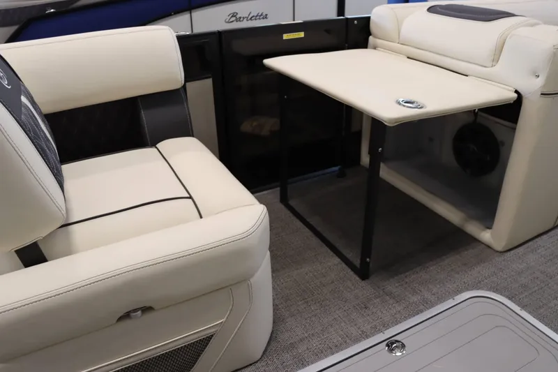 Slide: The Image of Luxurious interior of 2025 Barletta Lusso 23U pontoon boat with plush seating and table. - 12