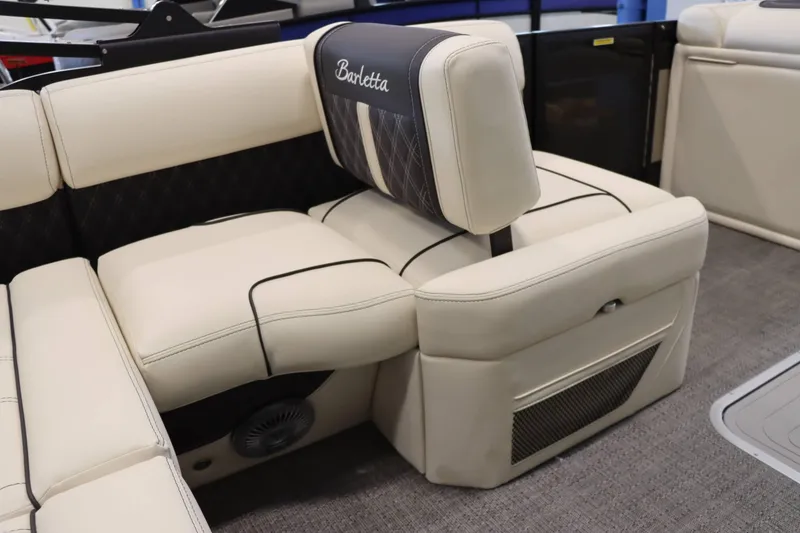 Slide: The Image of 2025 Barletta Lusso 23U boat interior with luxurious beige seating. - 9