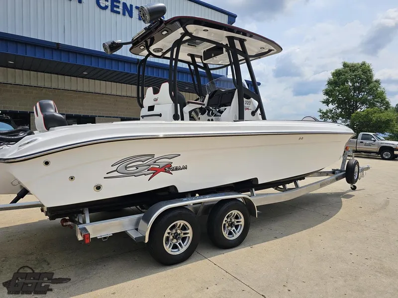 Slide: The Image of 2024 Glasstream 280 Pro GSX boat on a trailer outside a dealership. - 13