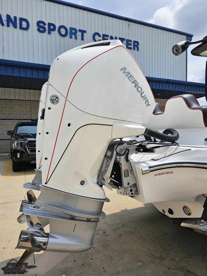 Slide: The Image of 2024 Glasstream 280 Pro GSX with Mercury outboard motor at a marine sport center. - 17