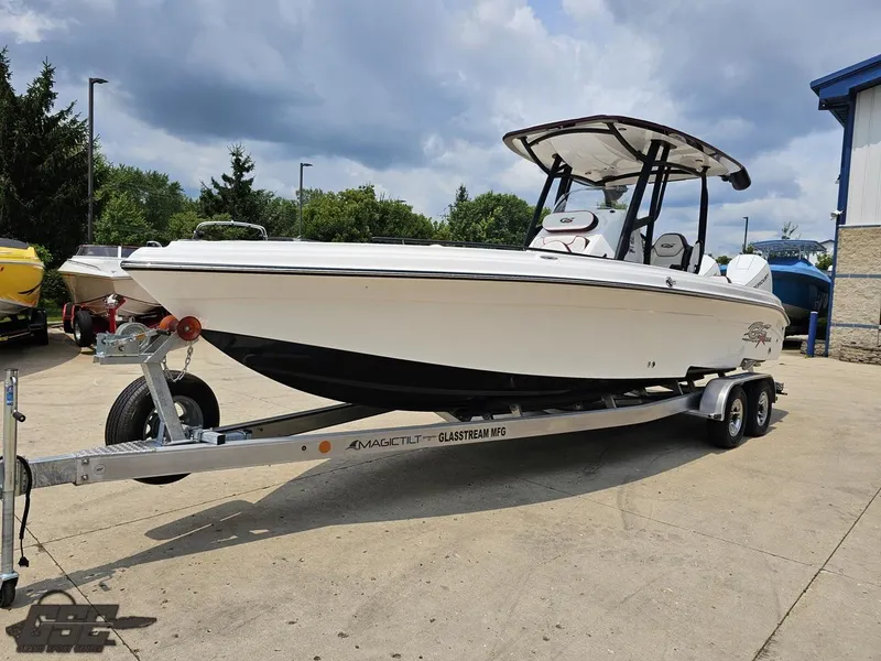 Slide: The Image of 2024 Glasstream 280 Pro GSX boat on a trailer, parked outdoors. - 26